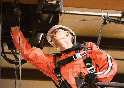 Konecranes technician inspecting crane